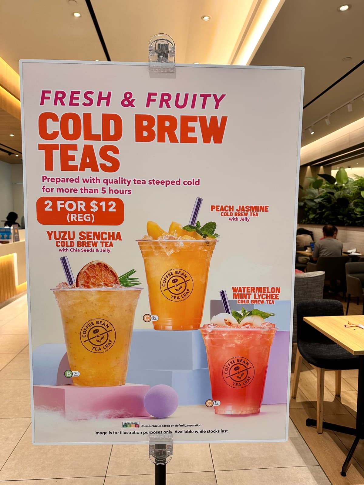 Coffee Bean & Tea Leaf 'Fresh & Fruity Cold Brew Teas' standee at the Suntec City outlet — three new flavours on a 2-for-$12 promo, May 2026