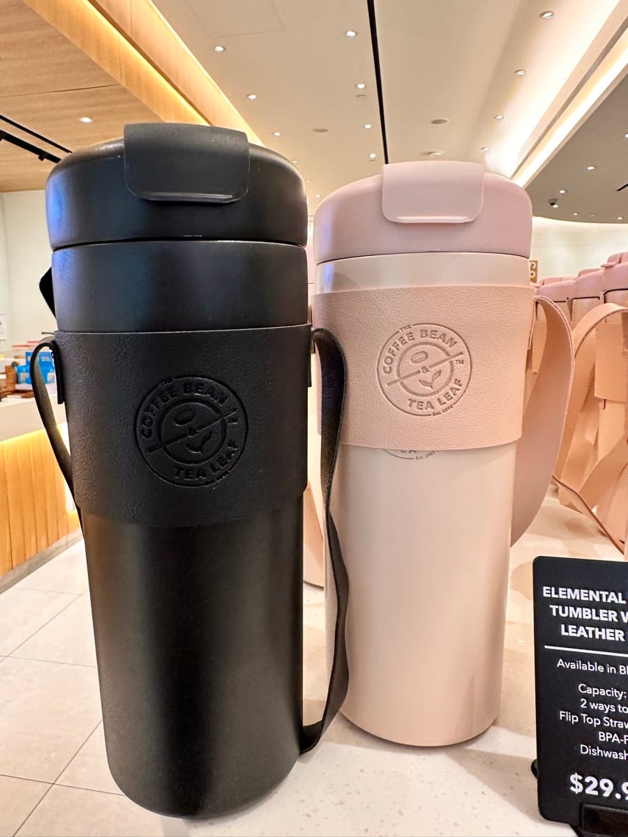 The Coffee Bean Elemental Duo-Sip Tumbler with PU Leather Strap — S$29.90 each, 720 ml, available in black and pink