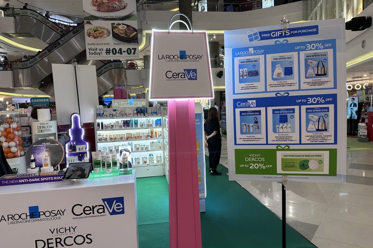 The La Roche-Posay, CeraVe and Vichy Dercos booth at the roadshow, with a signboard listing up to 30% off and free gifts with minimum spend.