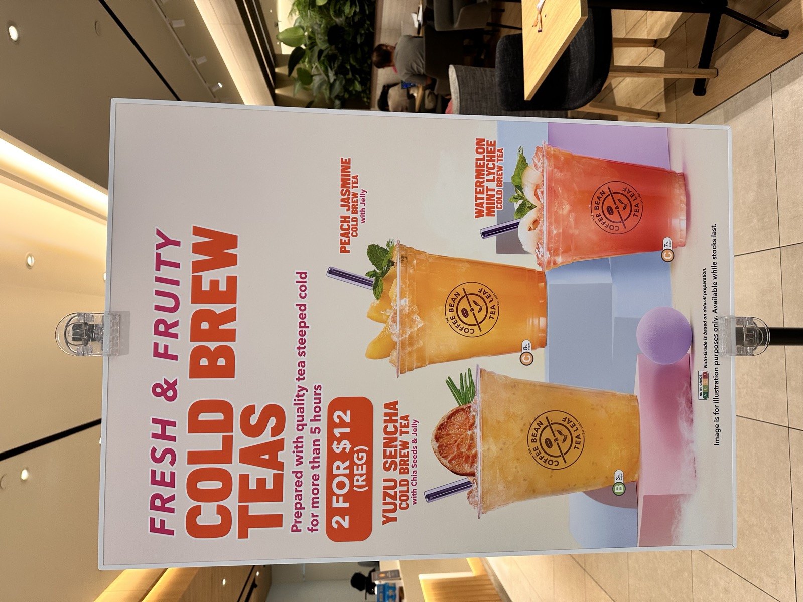 Coffee Bean & Tea Leaf 'Fresh & Fruity Cold Brew Teas' standee at the Suntec City outlet — three new flavours on a 2-for-$12 promo, May 2026