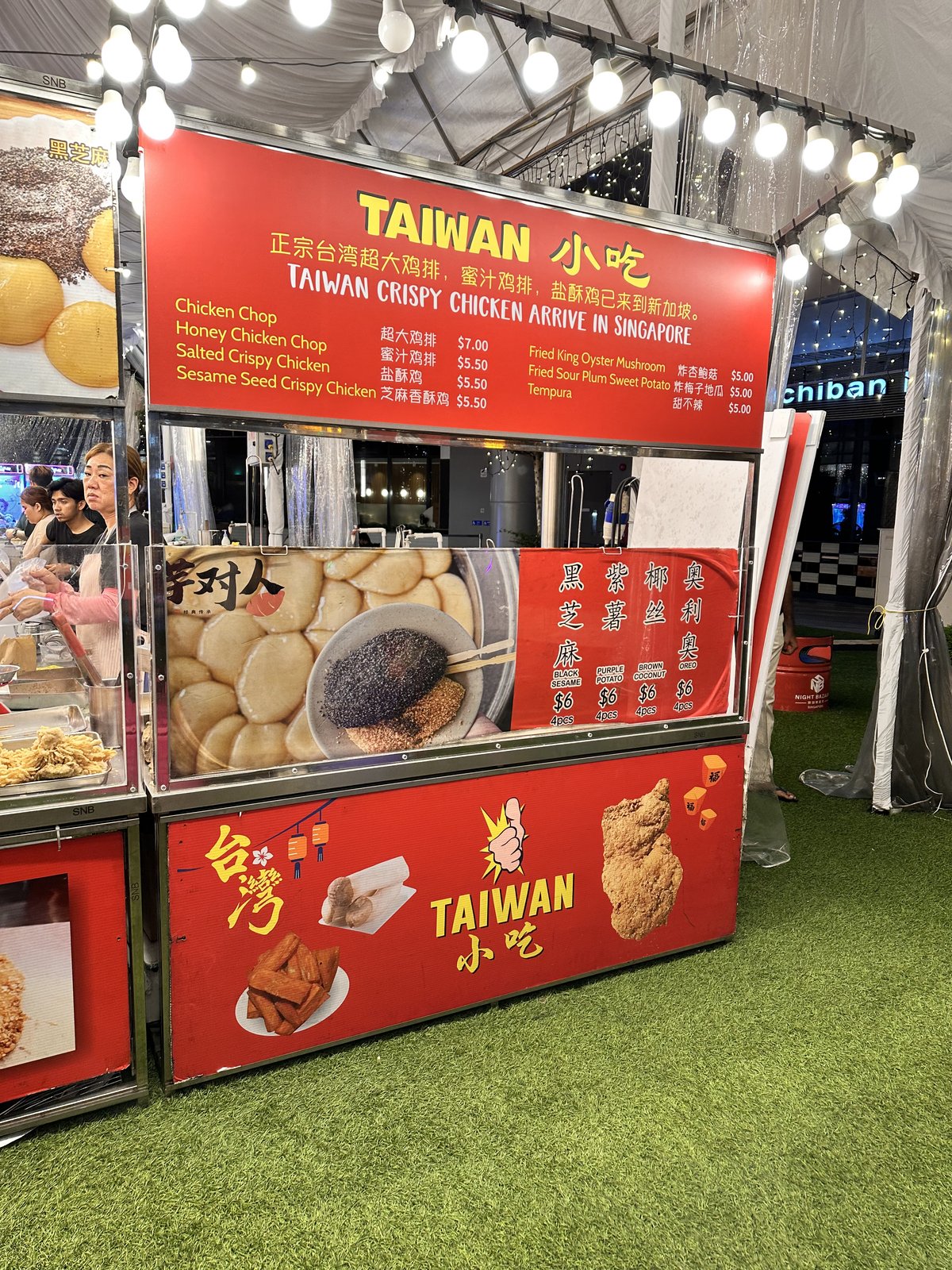 Taiwan Crispy Chicken stall sign at Punggol Waterway Point Taiwan Night Market — menu shows Chicken Chop $7, Honey Chicken Chop, Salted Crispy Chicken, Sesame Seed Crispy Chicken