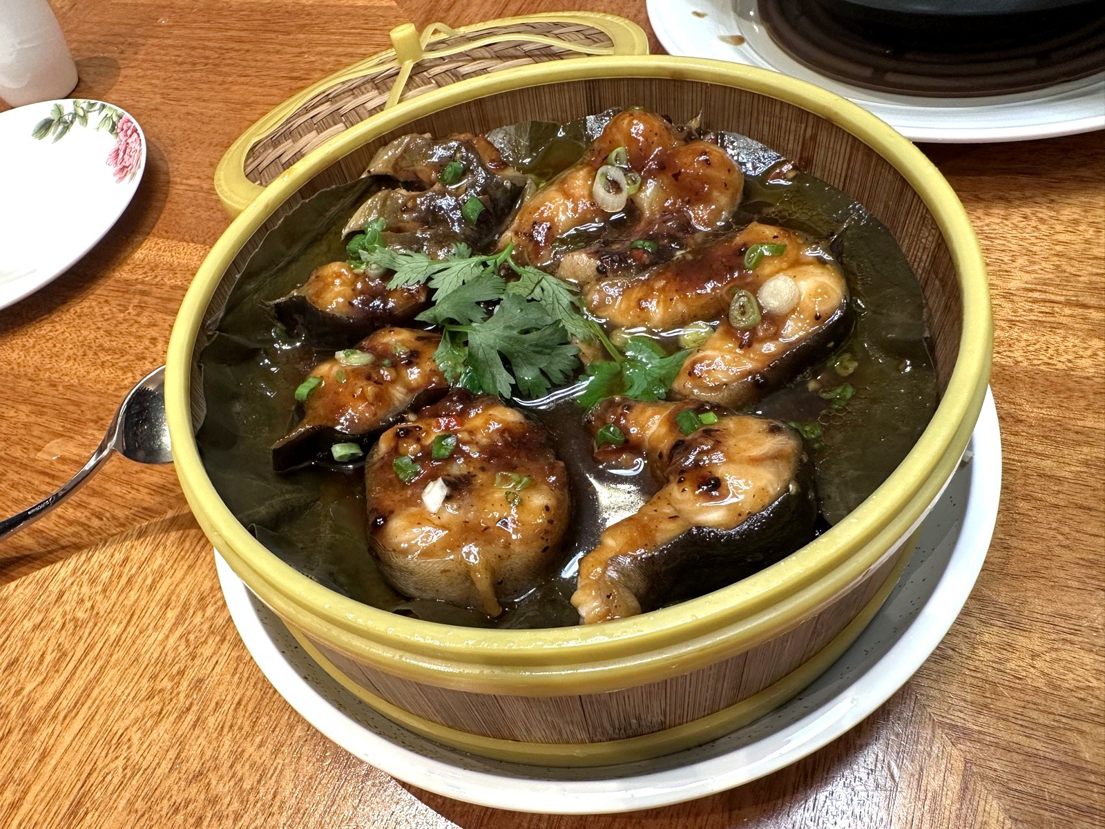 Bamboo steamer of white eel cutlets in black bean sauce at Xin Cuisine.